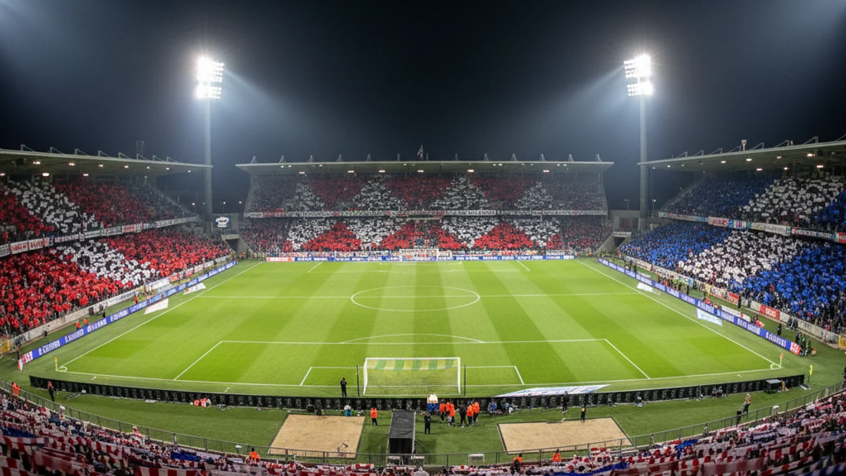 Vista general de l'estadi de futbol durant un partit de lliga, amb aficionats a les grades.