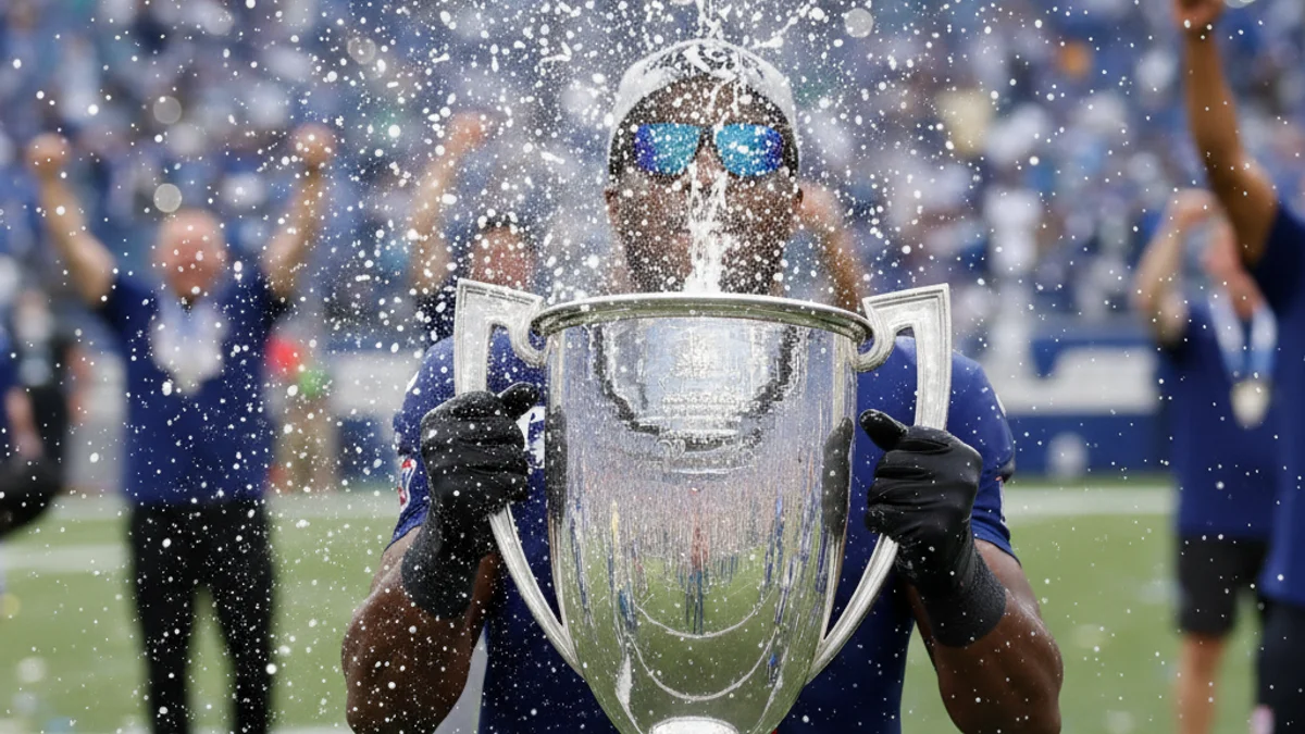 Imatge genèrica d'un jugador de futbol celebrant un títol amb ulleres de sol i xampany.