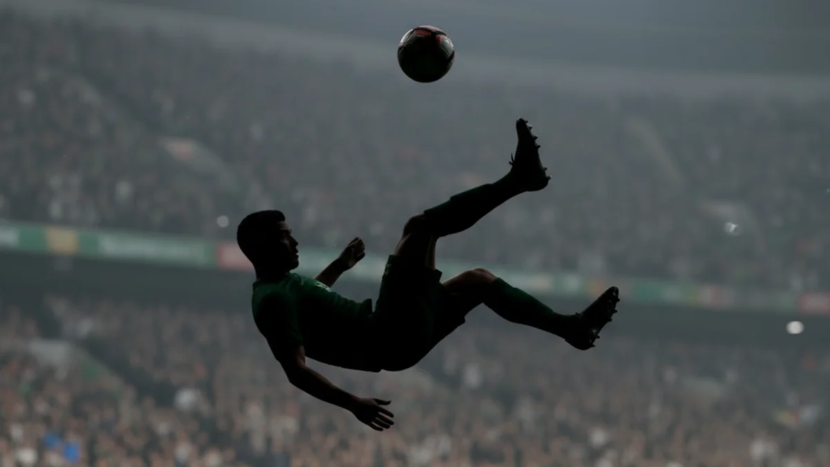 Imatge genèrica d'un partit de futbol amb un jugador celebrant un gol espectacular.