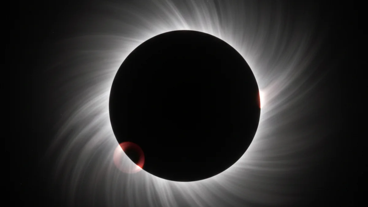 Representació visual d'un eclipsi solar total amb la Lluna cobrint completament el Sol i la corona solar visible.