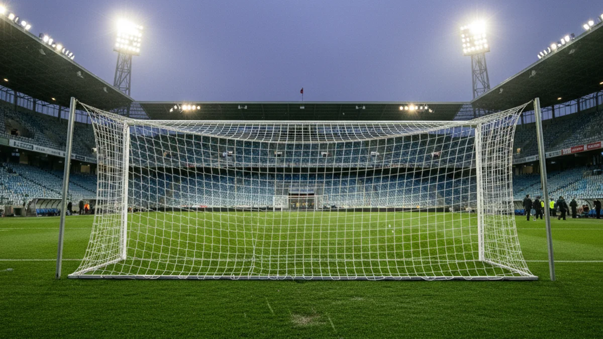 Generic image of an empty football field under stadium lights.