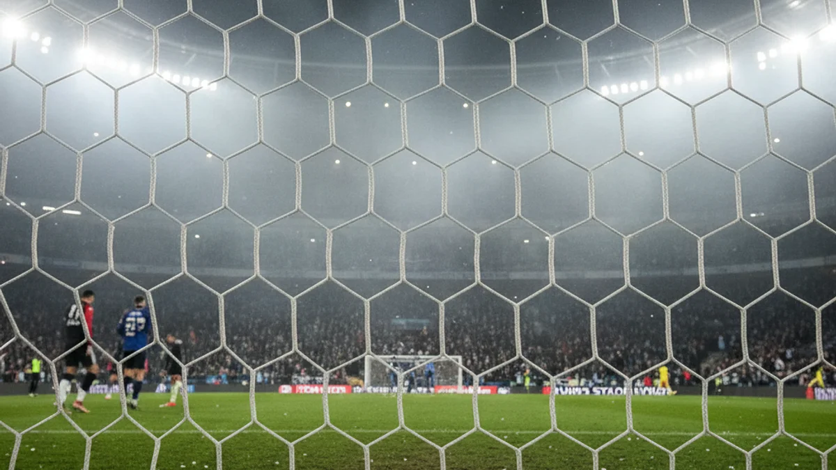 Generic image of a football goal under stadium floodlights during a night match.