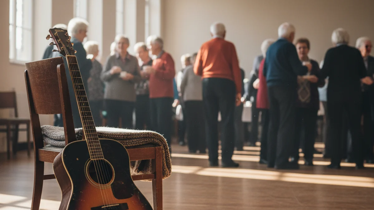 Generic image of a guitar in a community hall with elderly people in the background.