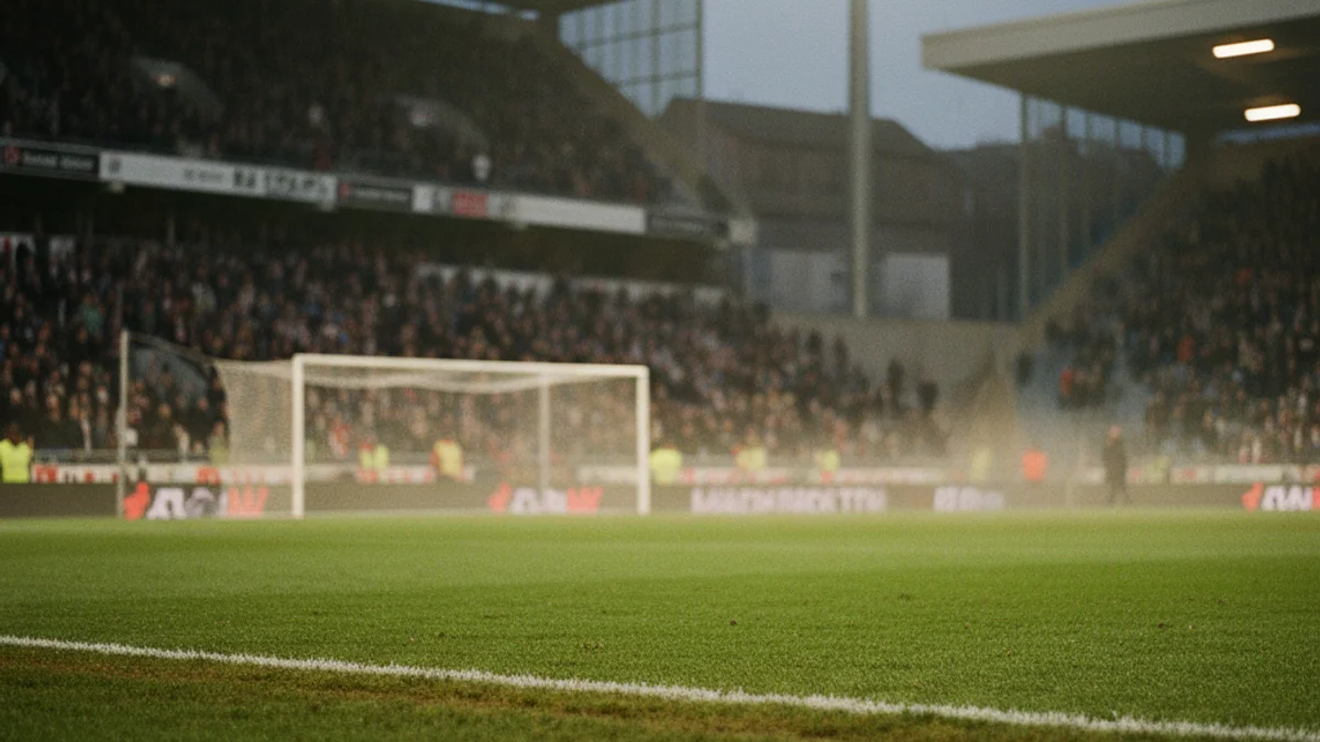 Generic image of a football field under stadium lights during an evening match.