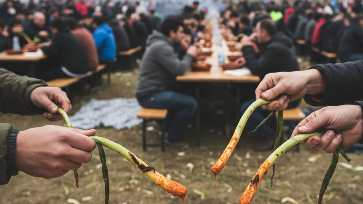 Imatge genèrica d'una calçotada popular amb taules plenes i gent menjant en un ambient festiu i comunitari.