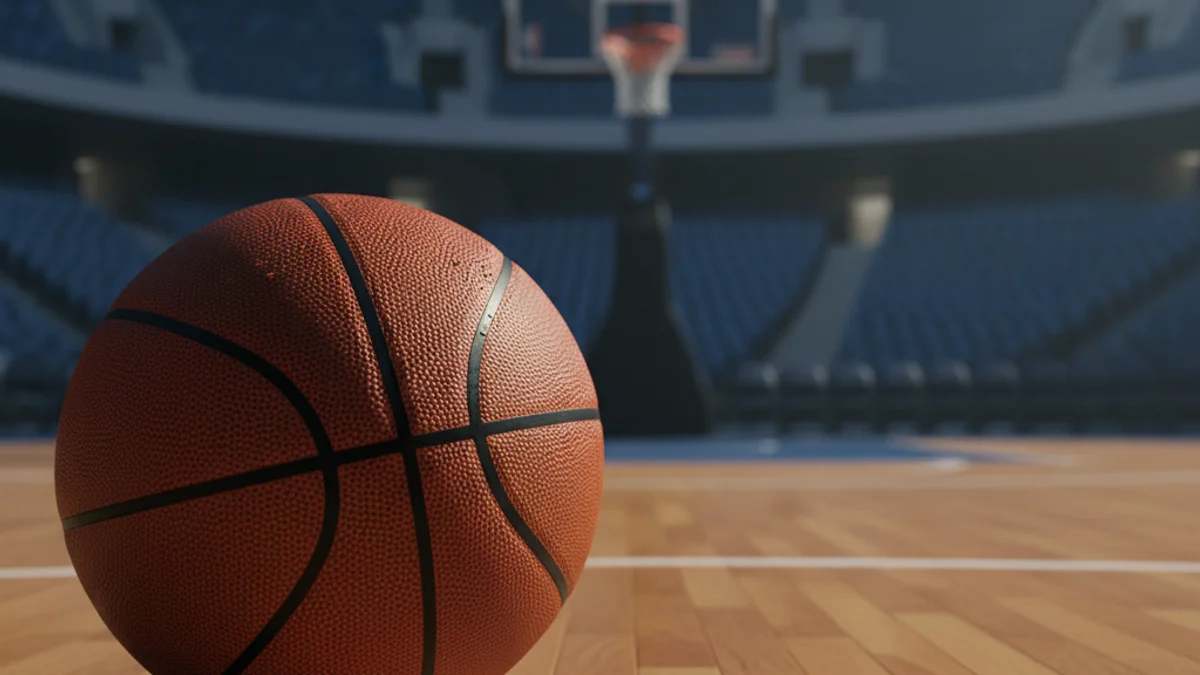 Generic image of a basketball on a professional court floor.