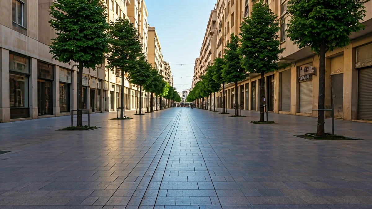 Generic image of a wide, sunny urban sidewalk with no shade on a hot day.