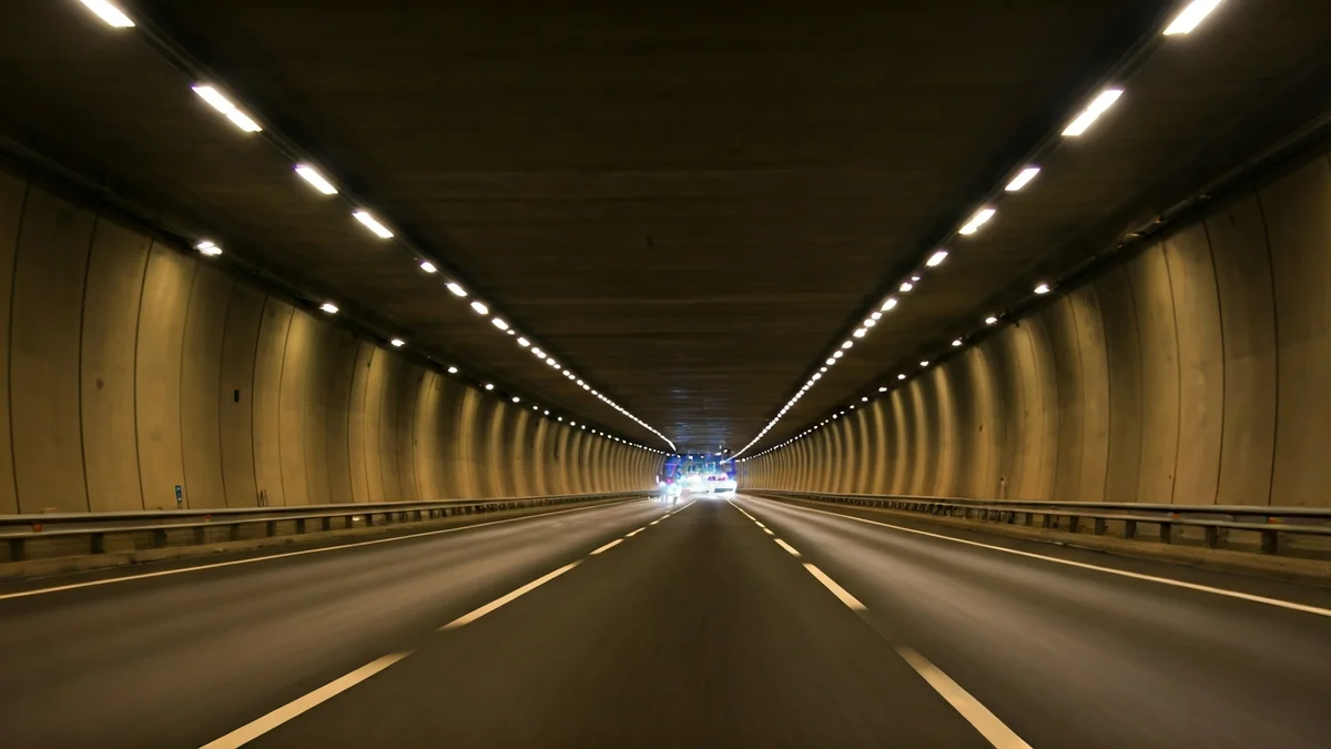Generic image of the interior of a modern tunnel with uniform lighting.