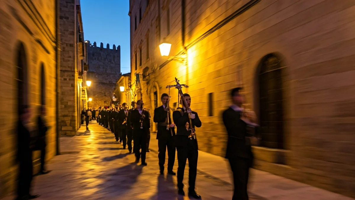 Generic image of a religious procession at dawn in a Mediterranean town.