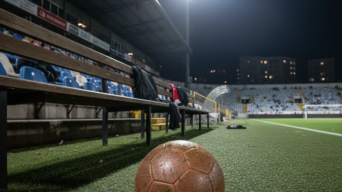 Generic image of a football stadium bench under spotlights.