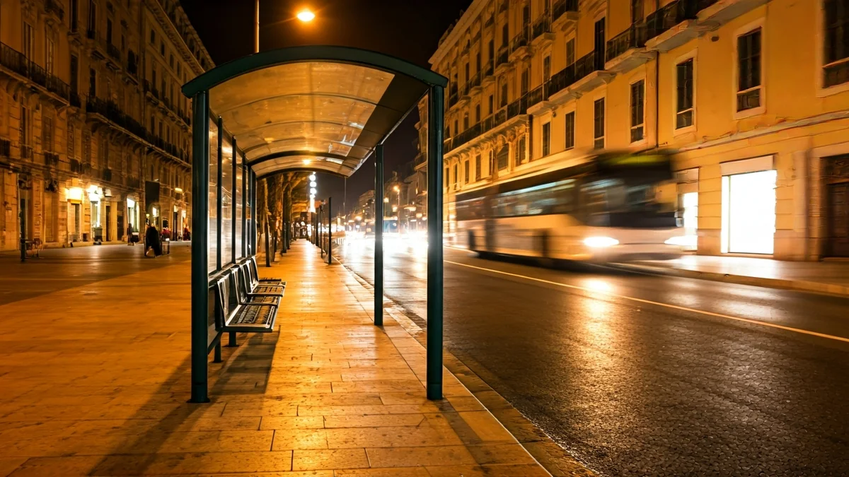 Generic image of an empty bus stop at night in a Mediterranean city