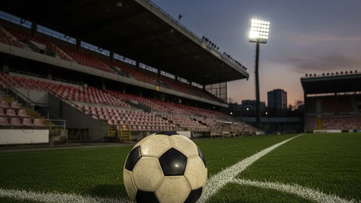 Generic image of a soccer ball on the goal line in an empty stadium.