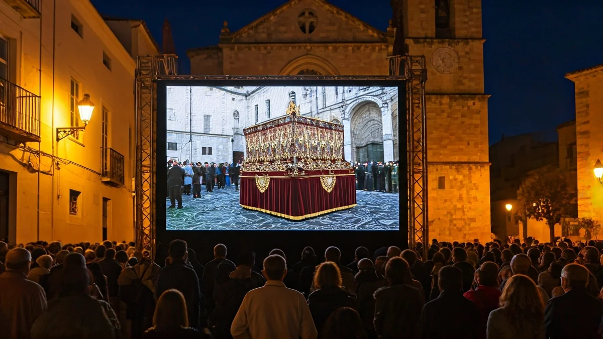 Imagen genérica de una pantalla gigante en una plaza, mostrando una procesión religiosa.