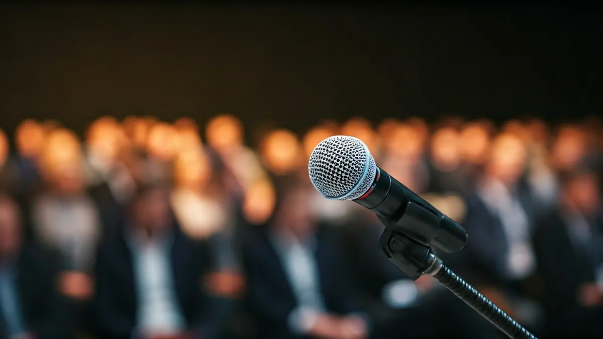 Generic image of a microphone on a podium during a public event.