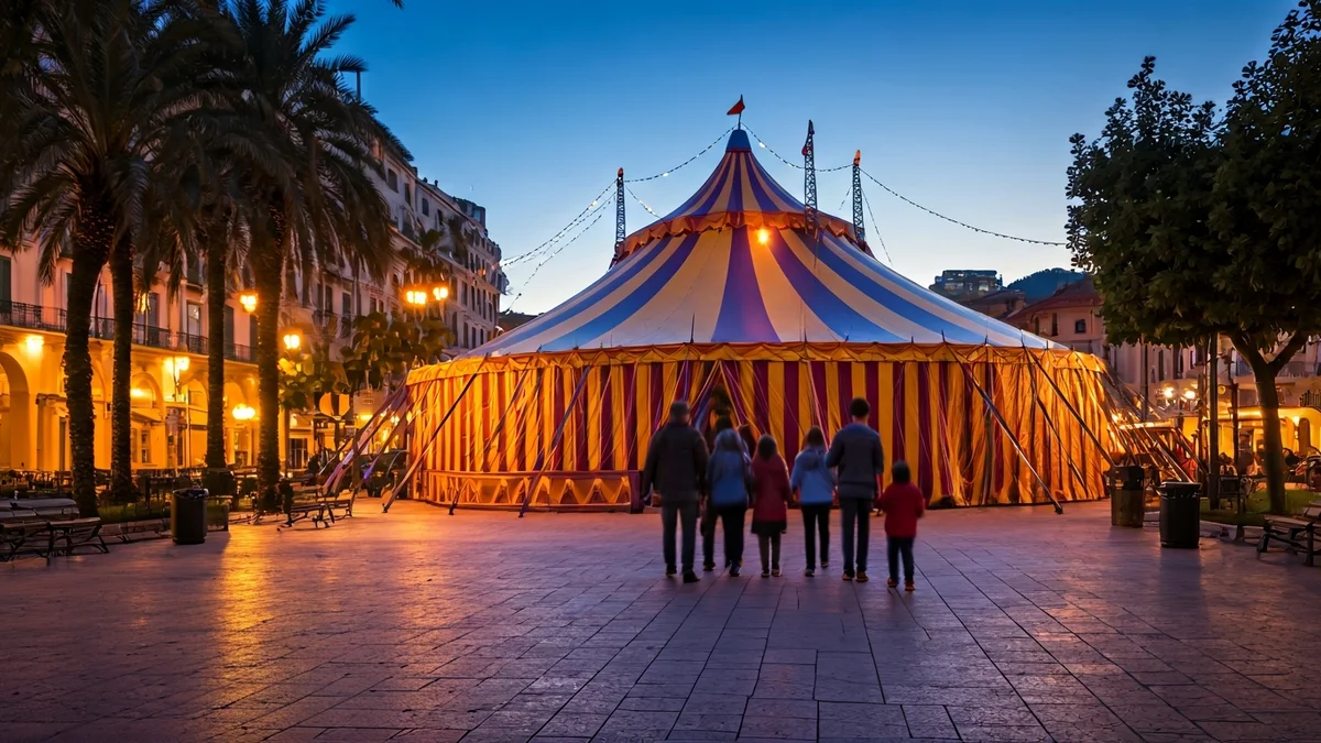 Imagen genérica de una carpa de circo iluminada al anochecer en un parque, con familias difuminadas cerca.