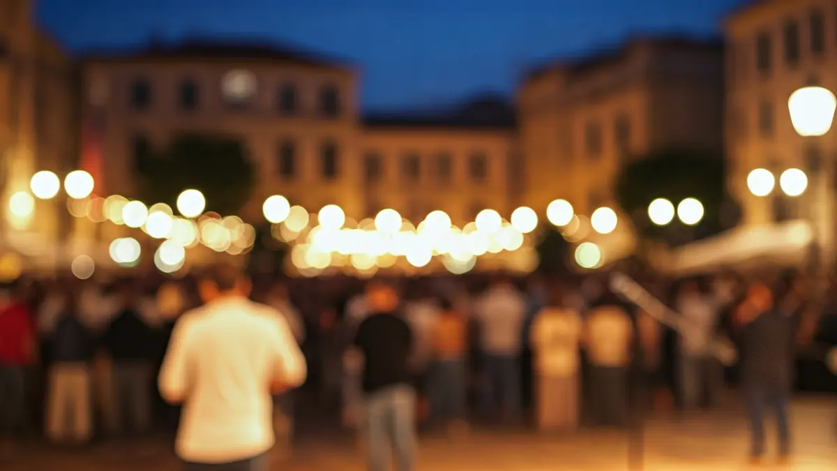 Image of a festive square with people and a stage, suggesting a festival program presentation.