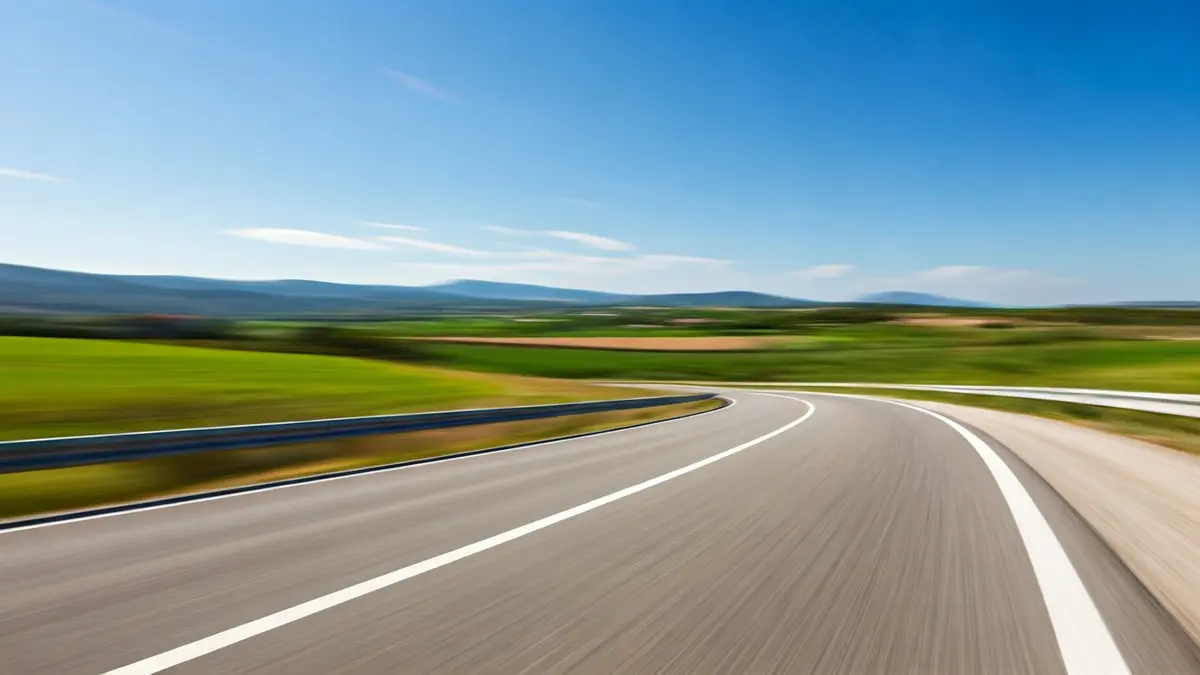 Generic image of a winding conventional road in a Mediterranean landscape.