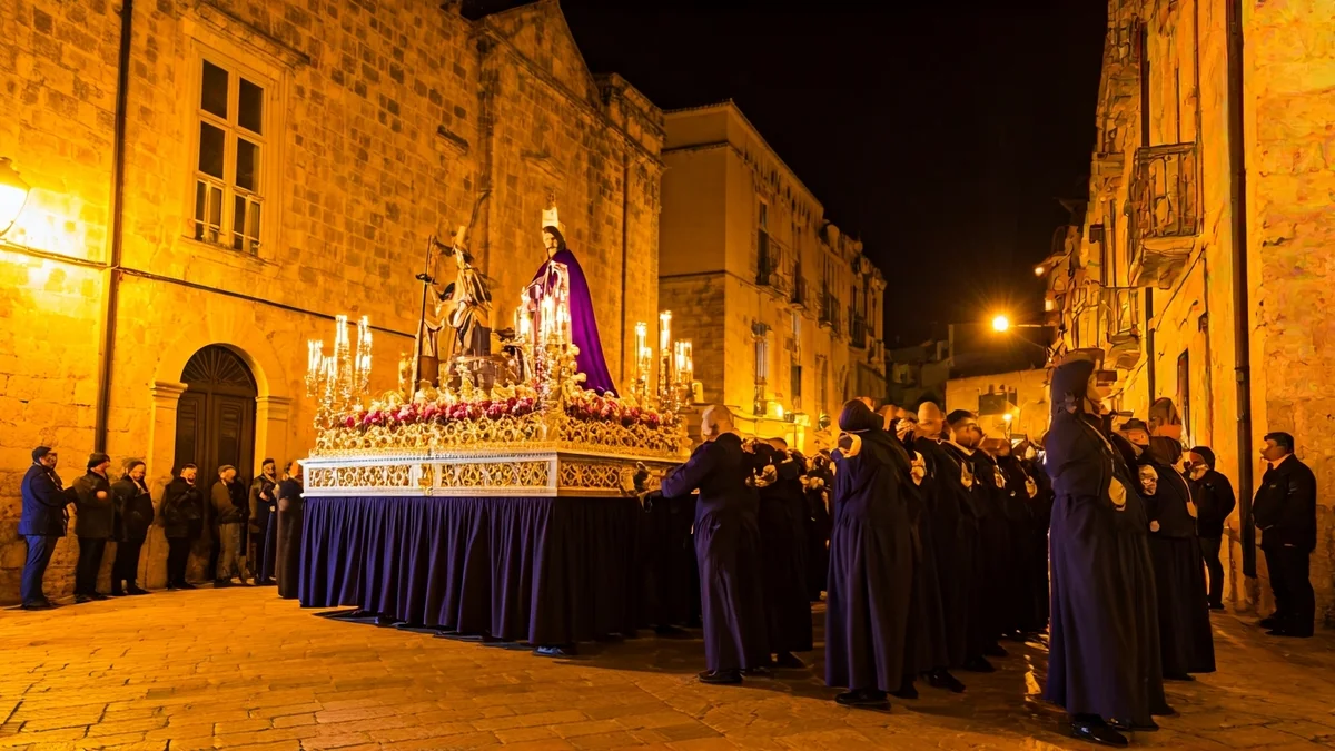 Image of a nocturnal religious procession in a historic Mediterranean city.