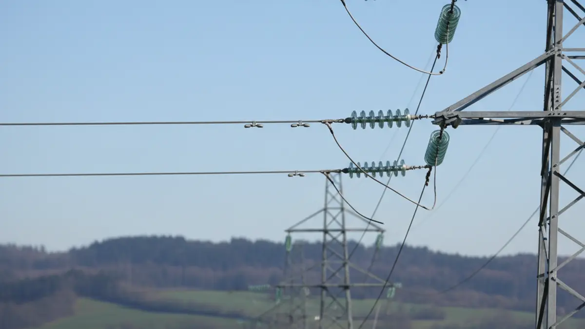 Generic image of power lines in a rural setting.