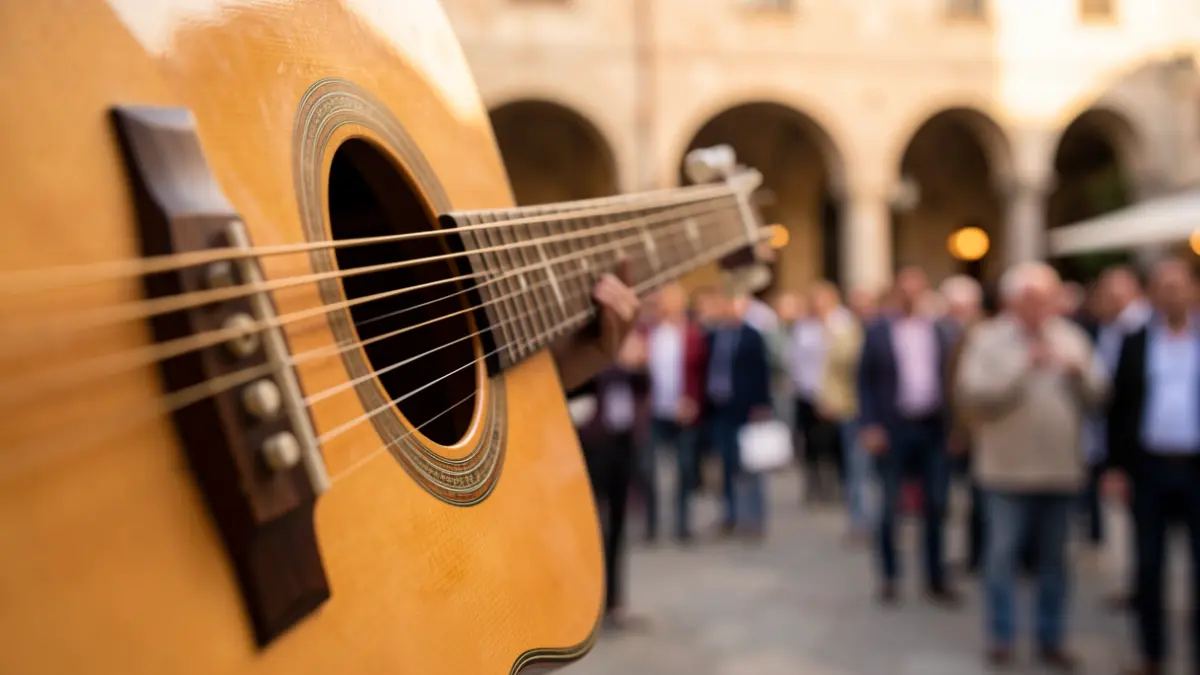 Generic image of acoustic guitar strings with Mediterranean architectural details in the background.