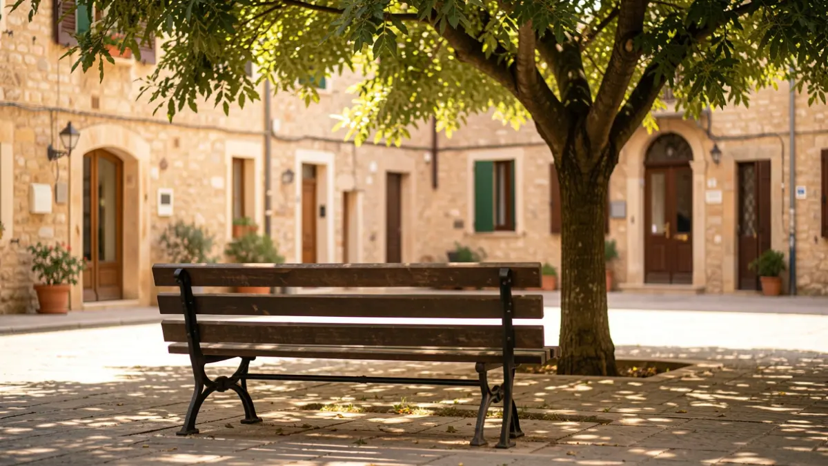 Generic image of a shaded bench in a Mediterranean town square.