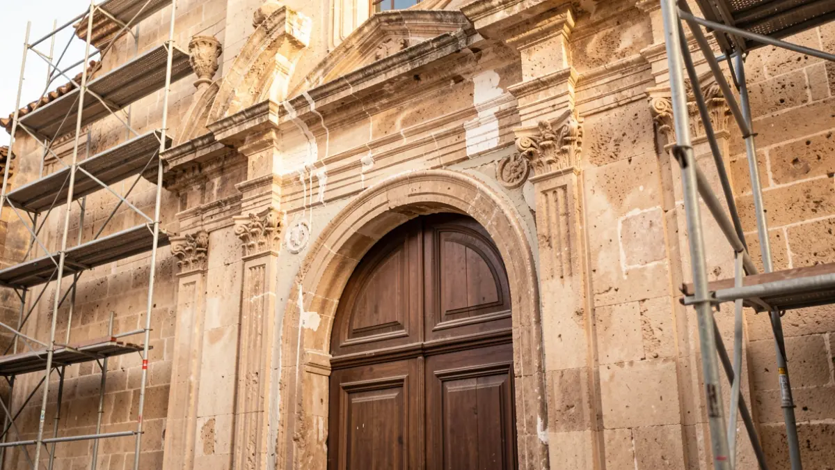 Baroque portal of the Sant Agustí church in Alfara de Carles during restoration works.