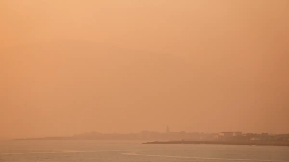 Orange and hazy sky over the Catalan coast due to Saharan dust.