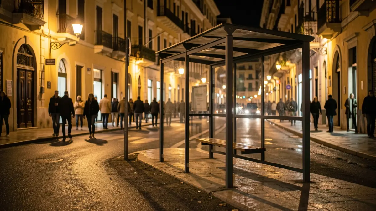 Generic image of an empty bus stop at night.