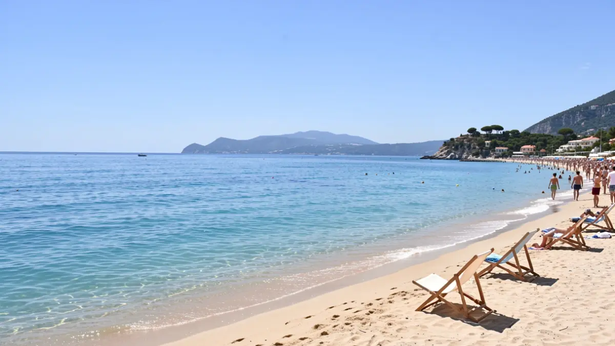 Generic image of a tranquil Mediterranean beach with clear water and beach chairs.