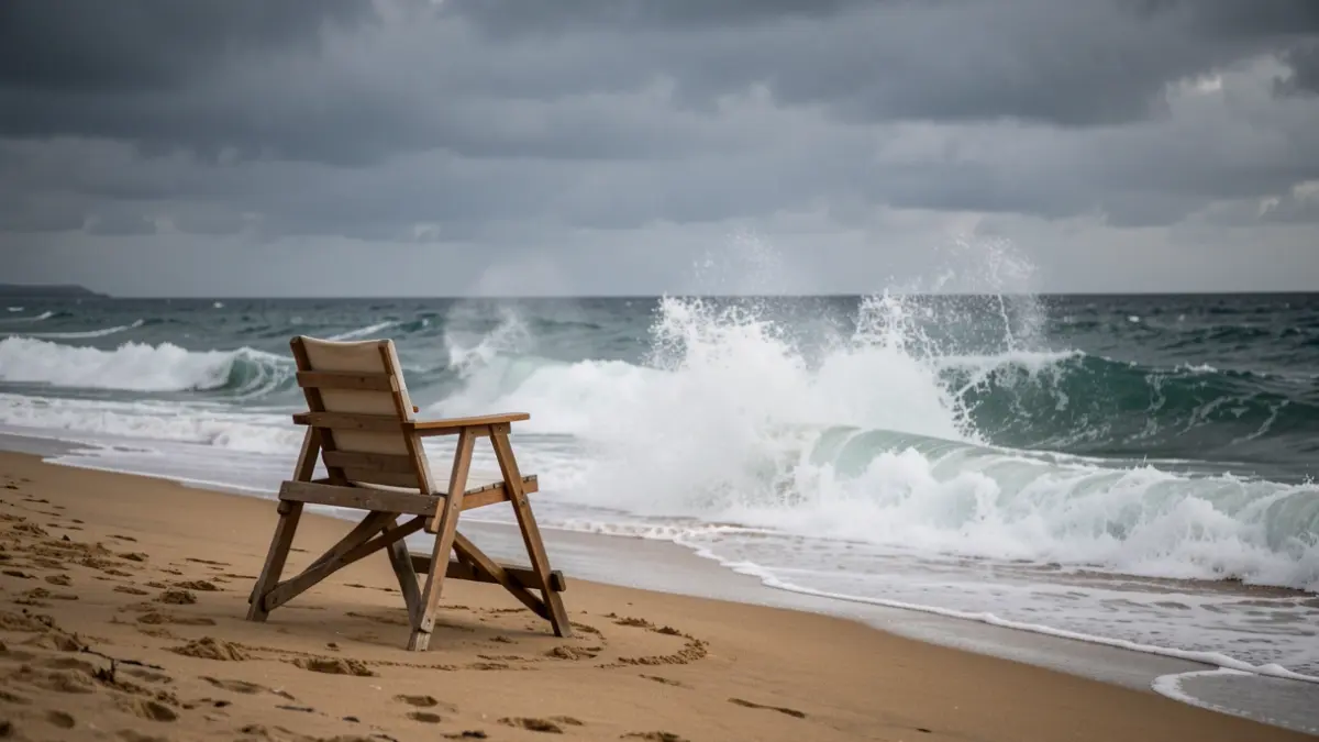 Generic image of a beach with breaking waves and an empty lifeguard chair.