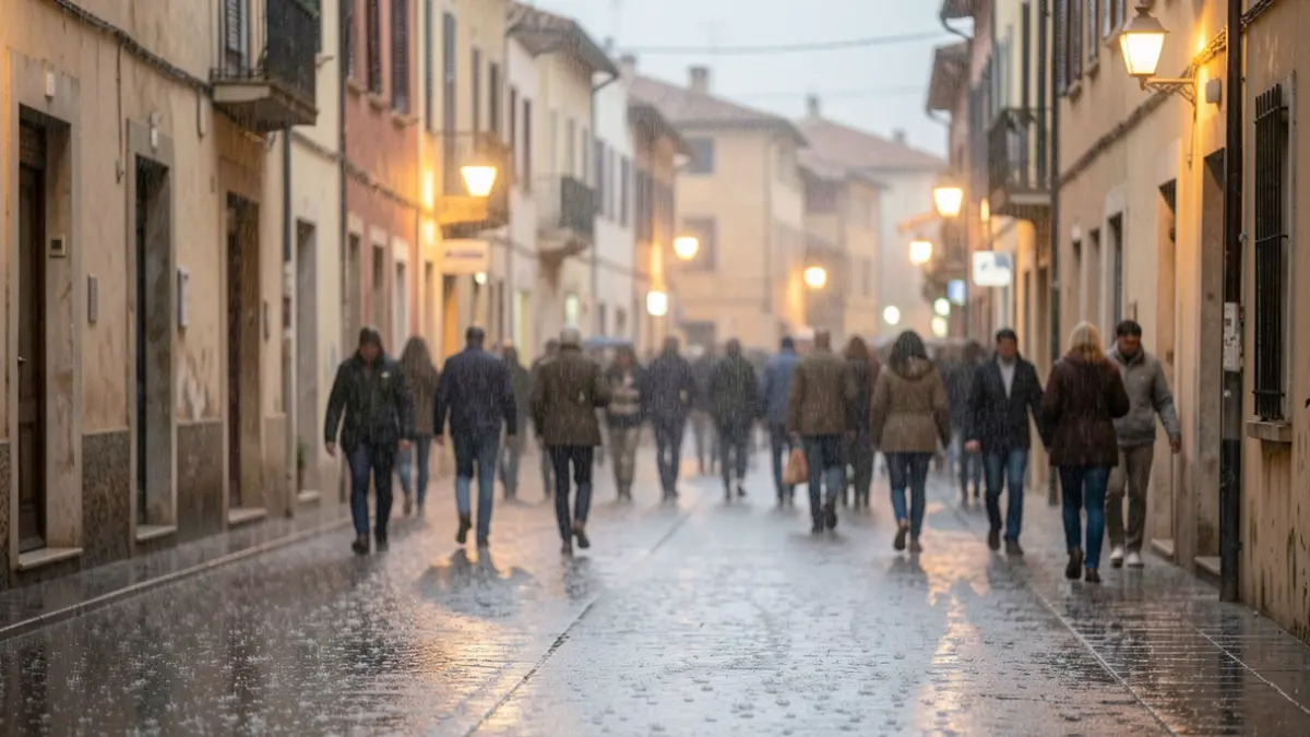 Generic image of heavy rain falling on a wet, empty street in a Mediterranean city.