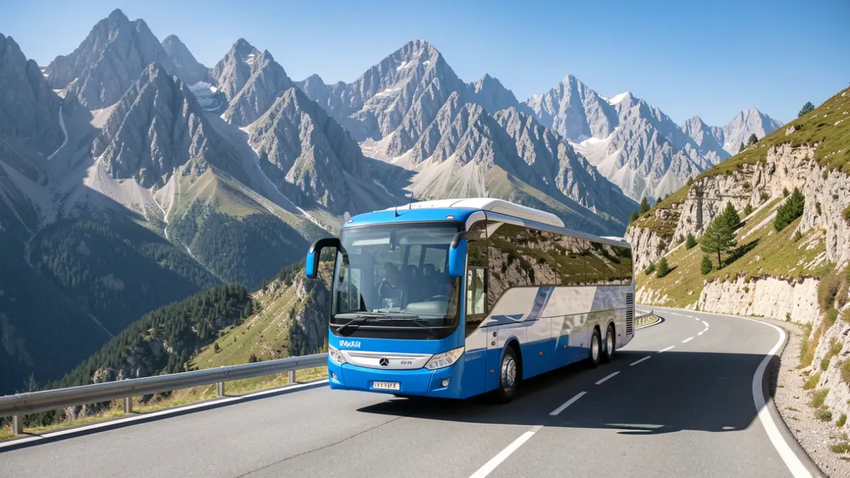 Intercity bus driving on a mountain road in the Pyrenees.